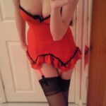 Teen girl in red lingerie strips.