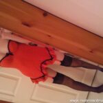 Teen girl in red lingerie strips.