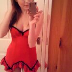 Teen girl in red lingerie strips.