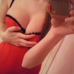 Teen girl in red lingerie strips.