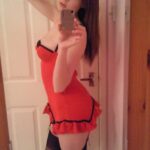 Teen girl in red lingerie strips.