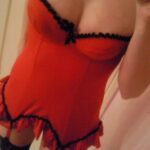 Teen girl in red lingerie strips.